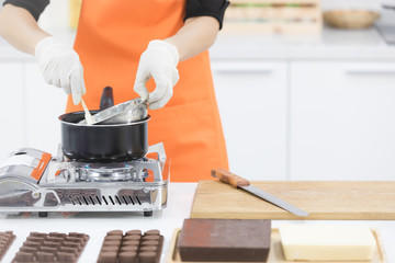 Woman making chocolate