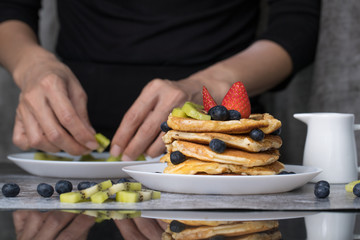Woman preparing pancakes