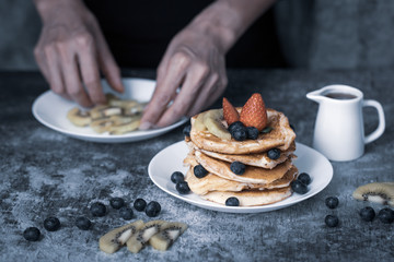 Woman preparing pancakes