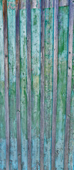 Fototapeta na wymiar Cracked weathered blue and green shabby chic painted wooden board texture, front view
