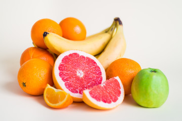 Fresh orange juice with fruits, isolated on white