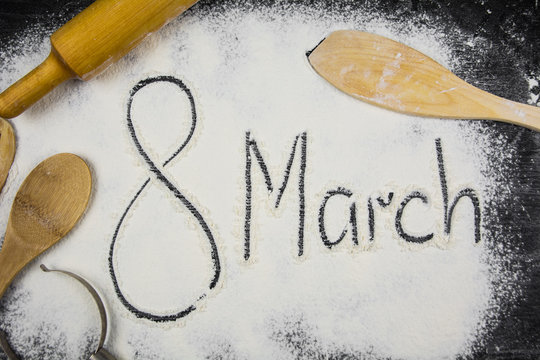 Text written on scattered flour. 8 march concept