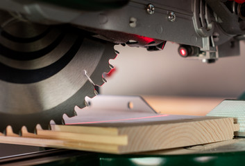  Modern electric circular saw in the workshop