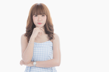 Front view close-up portrait of young beautiful Asian woman with curly long dark brown hair in light blue checked dress stand up straight  isolated white background