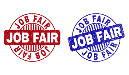 Grunge JOB FAIR round stamp seals isolated on a white background. Round seals with grunge texture in red and blue colors. Vector rubber overlay of JOB FAIR text inside circle form with stripes.