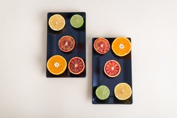 Ripe Citrus Fruit on dark backdrop. Orange, Lime, Lemon Mint. Healthy Food. Summer Background. Juicy, juice.