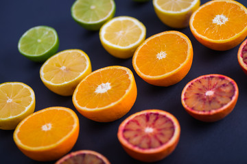 Ripe Citrus Fruit on dark backdrop. Orange, Lime, Lemon Mint. Healthy Food. Summer Background. Juicy, juice.