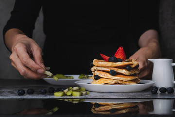 Woman preparing pancakes