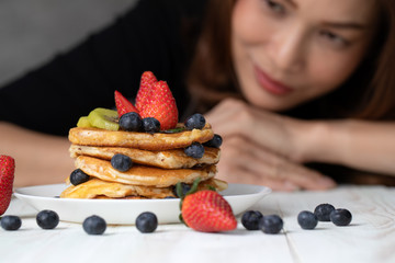 Housewife preparing pancakes