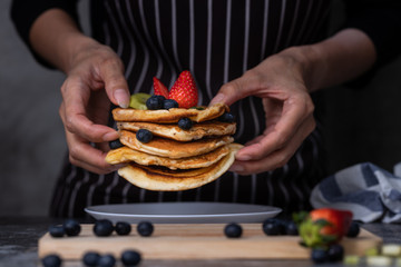Woman preparing pancakes