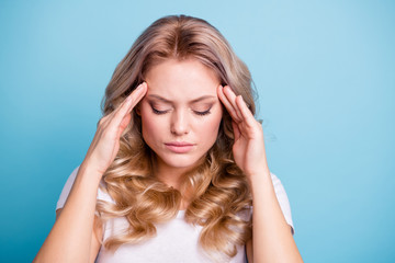 Close up photo beautiful her she lady hands arms hold touch temples show bad feeling forehead eyes closed tension wear casual white t-shirt jeans denim clothes outfit isolated bright blue background