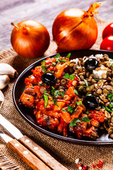 Rice with lentils and vegetables on wooden table