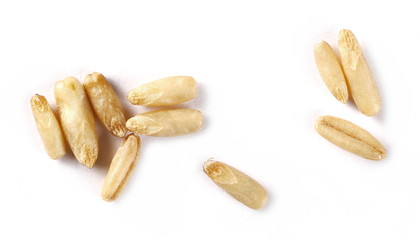 Peeled oat grains isolated on white background, macro