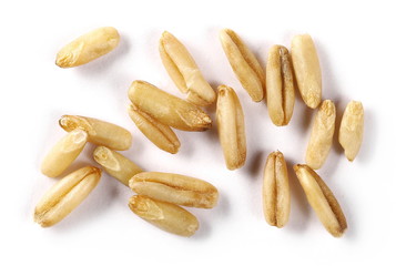 Peeled oat grains isolated on white background, macro