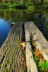 Old pier in the village on the lake close-up.