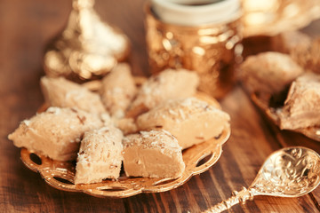 Turkish sweets with coffee on a wooden table