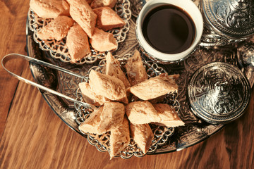 Turkish sweets with coffee on a wooden table