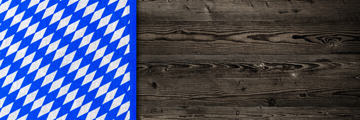 Oktoberfest background. Blue white cloth on wooden table