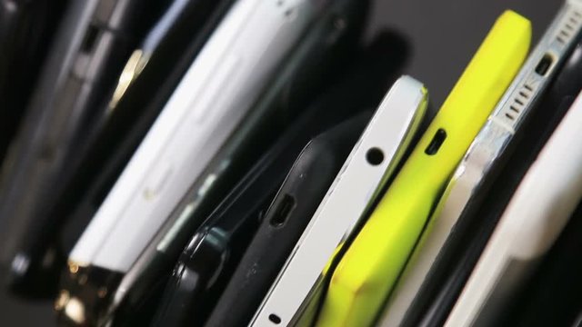 old, broken and scratched smartphones and mobile phones. video rotation