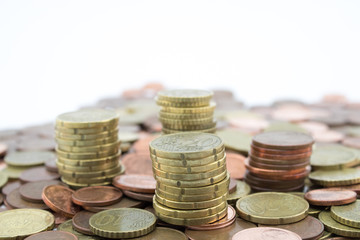 Stack of euro cents coins of different value on white background. Economy.