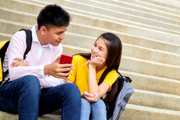 Attractive young couple listening to music