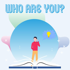 Text sign showing Who Are You question. Business photo showcasing asking about demonstrating identity or demonstratingal information Man Standing Behind Open Book, Hand on Head, Jagged Speech Bubble