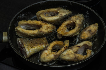 Fish carp fried in a pan