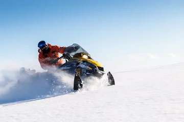 Rolgordijnen Athlete on a snowmobile. © 02irina