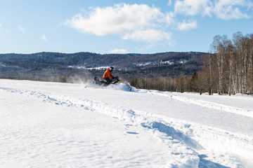 Athlete on a snowmobile.