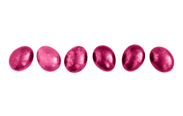 Pink Easter eggs in a row on isolated white background.