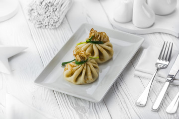 Homemade meat dumplings on a white plate