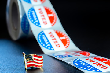 American flag on I voted today stickers, patriotic motive during the elections of the American president.