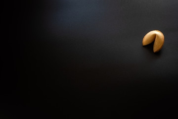 Fortune cookies on black background.