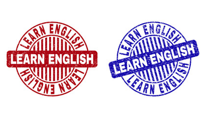 Grunge LEARN ENGLISH round stamp seals isolated on a white background. Round seals with grunge texture in red and blue colors.