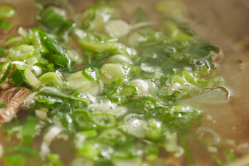 Spring onions in Korean beef soup