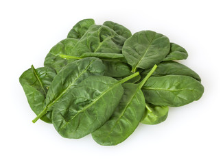Heap of fresh spinach leafs isolated on white background