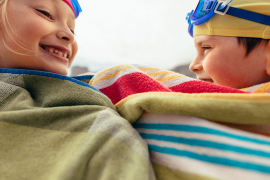 Two kids having fun after swimming