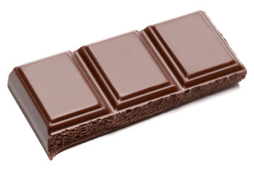 Dark organic chocolate pieces isolated on white background