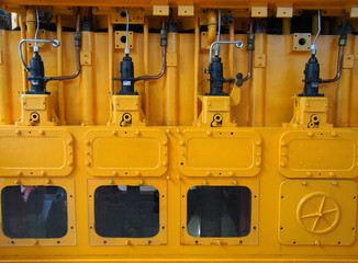 full frame image of a large yellow diesel engine used as an emergency standby electrical generator