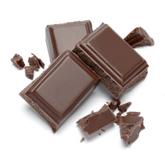 Dark organic chocolate pieces isolated on white background