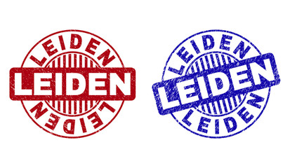 Grunge LEIDEN round stamp seals isolated on a white background. Round seals with grunge texture in red and blue colors. Vector rubber watermark of LEIDEN caption inside circle form with stripes.