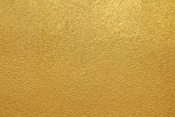 Gold concrete wall on background texture.
