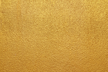 Gold concrete wall on background texture.