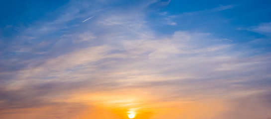 evening cloudy sky at the sunset