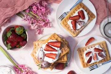 Waffles with strawberries and whipped cream