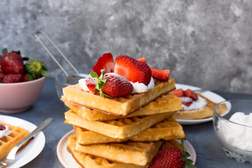 Waffles with strawberries and whipped cream