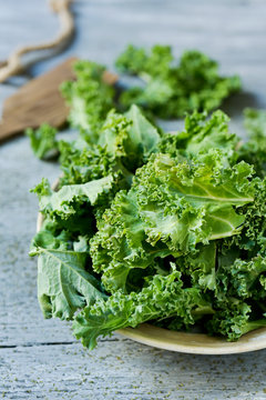 chopped kale on a rustic wooden table