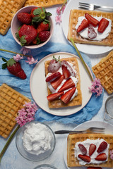 Homemade belgian Waffle. Strawberies and whiped cream.