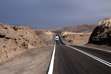 Endless Panamericana (Ruta 5) through barren landscape with lonely truck in the horizon - North of...
