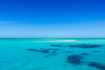 beautiful great barrier reef with white clouds on a sunny day, cairns, australia
